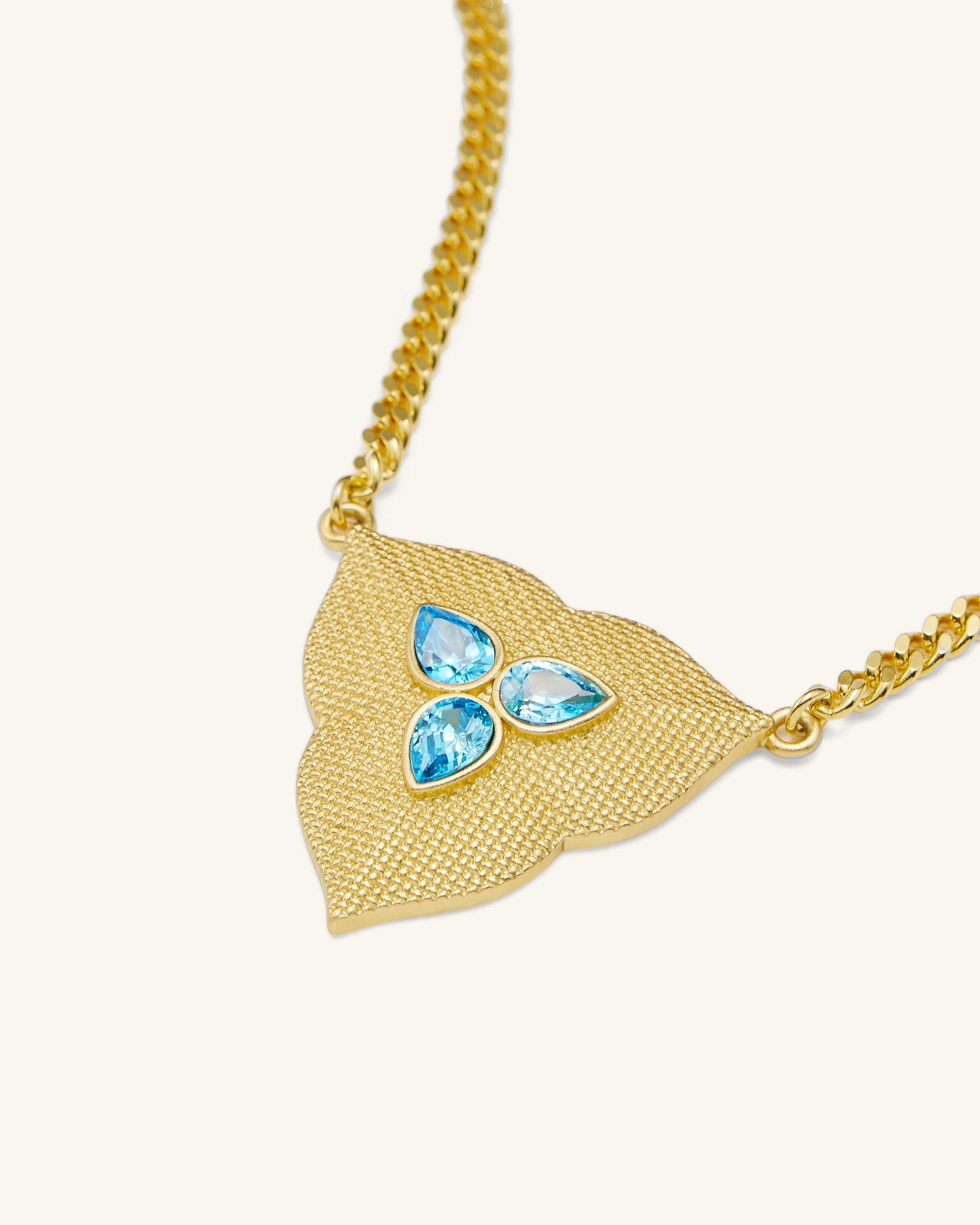 NE002-4_b_e7103f76-2446-480f-9630-bf189af536e3 Leaf Pendant Necklace - 18ct Gold Plated & Aquamarine Zircon - Image 1